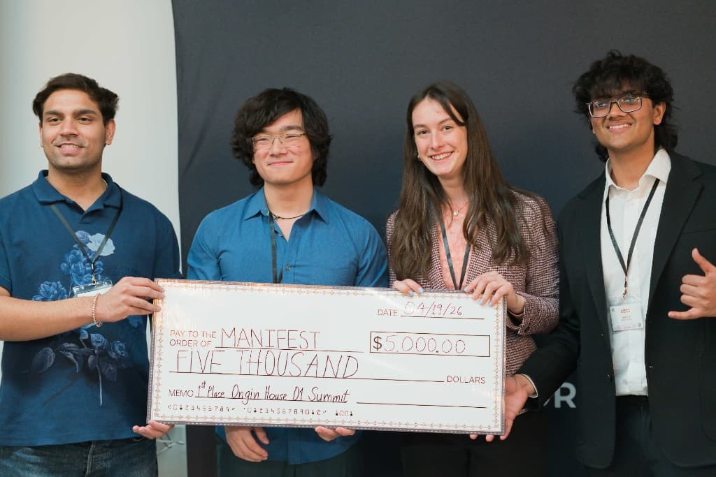 Manifest team with first place check